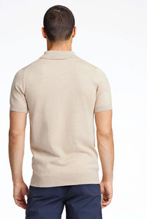 Back image of a model wearing the Ecovero s/s knit polo in sand, by brand Lindbergh