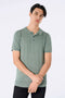 Front image of a model wearing Ecovero s/s knit polo in light green, by brand Lindbergh
