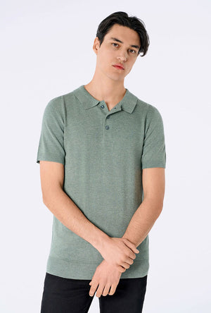 Front image of a model wearing the Ecovero s/s knit polo in light green, by brand Lindbergh
