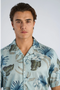 Front image of a model wearing the Floral lyocell blend shirt in aqua, by brand Lindbergh