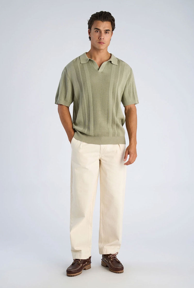 Front image of a model wearing Knitted s/s polo in light green, by brand Lindbergh