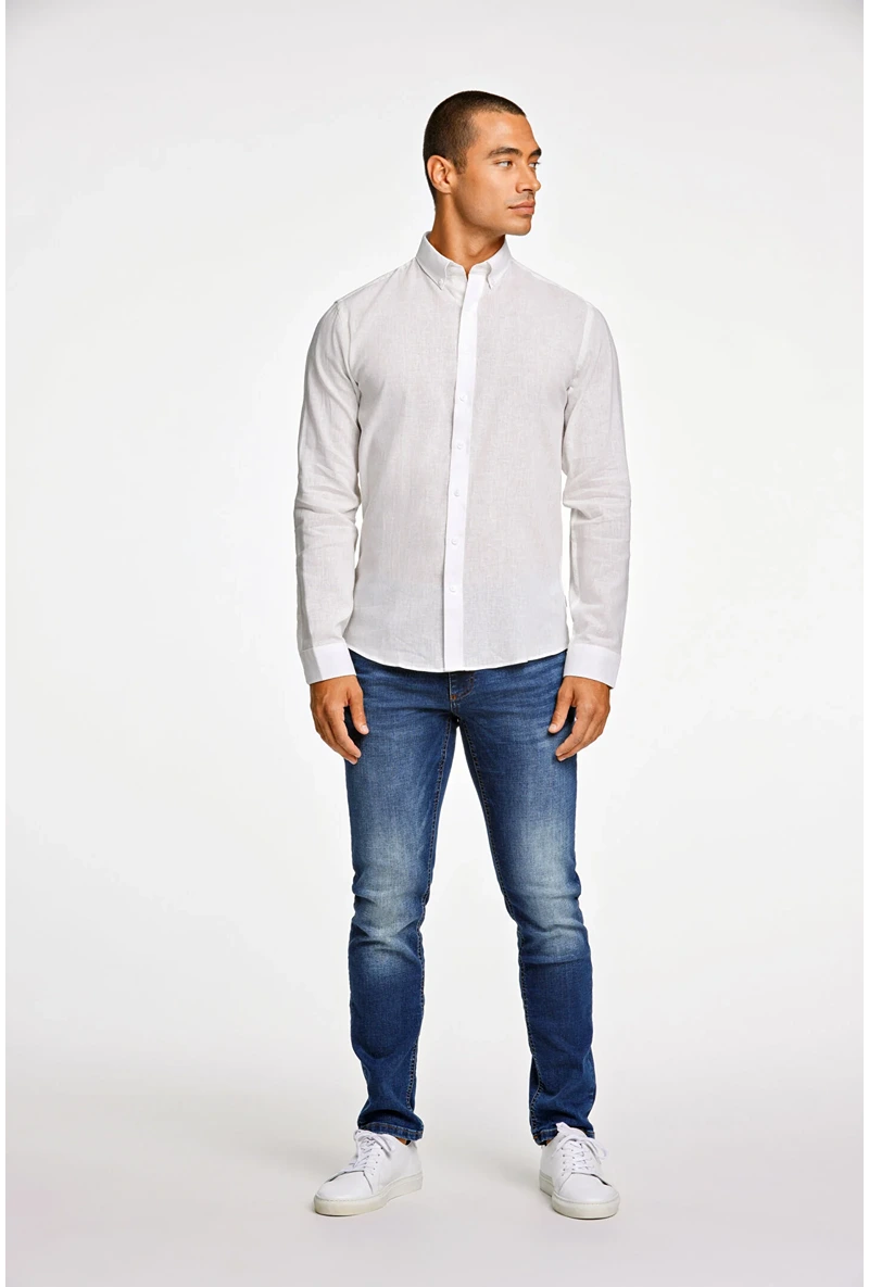 Front image of a model wearing Linen/cotton ls shirt in white, by brand Lindbergh