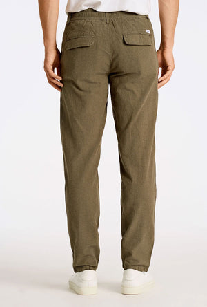 Back image of a model wearing the Relaxed fit linen trousers in khaki, by brand Lindbergh
