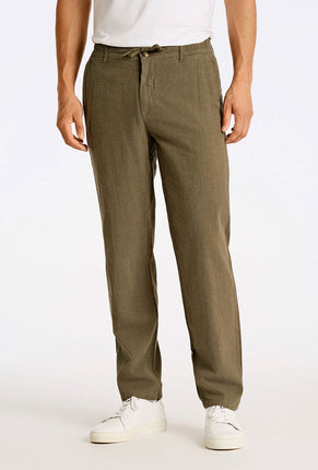 Front image of a model wearing Relaxed fit linen trousers in khaki, by brand Lindbergh