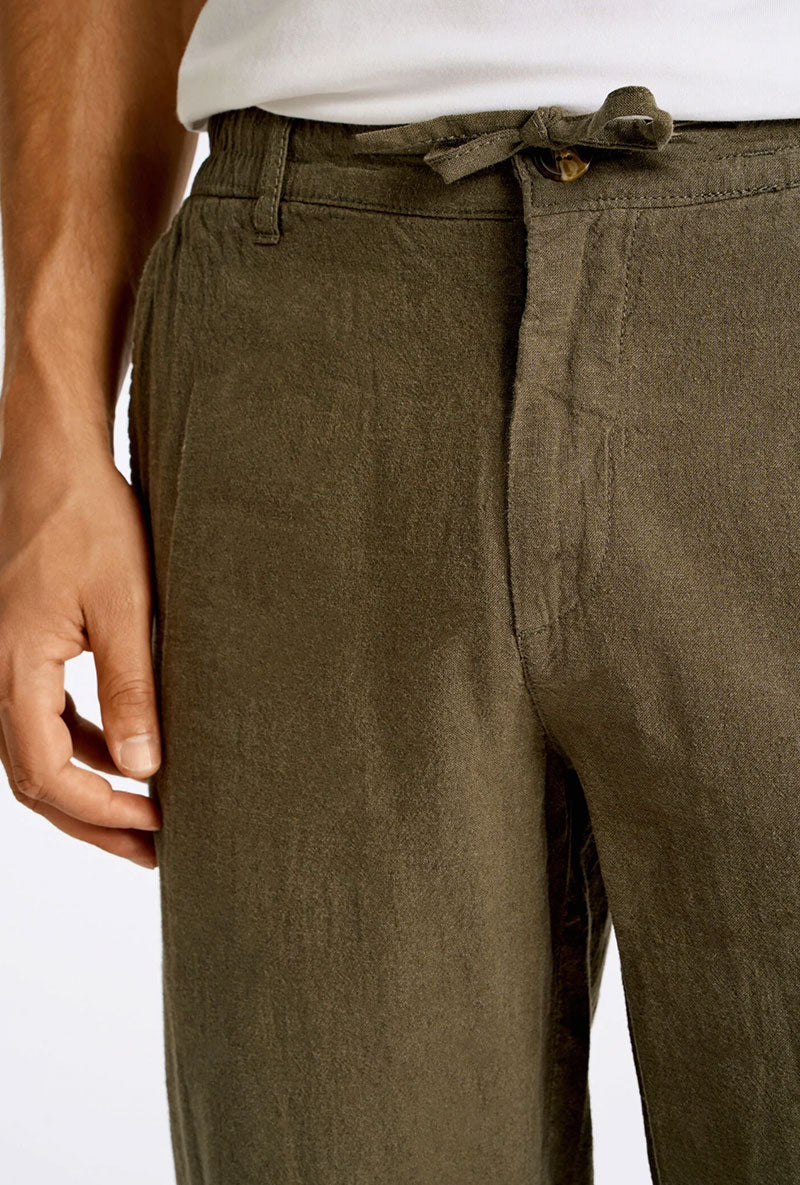 Front image of a model wearing Relaxed fit linen trousers in khaki, by brand Lindbergh