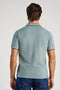 Back image of a model wearing the S/s contrast polo in aqua, by brand Lindbergh
