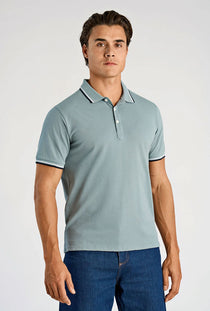 Front image of a model wearing the S/s contrast polo in aqua, by brand Lindbergh