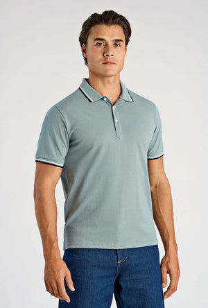 Front image of a model wearing the S/s contrast polo in aqua, by brand Lindbergh