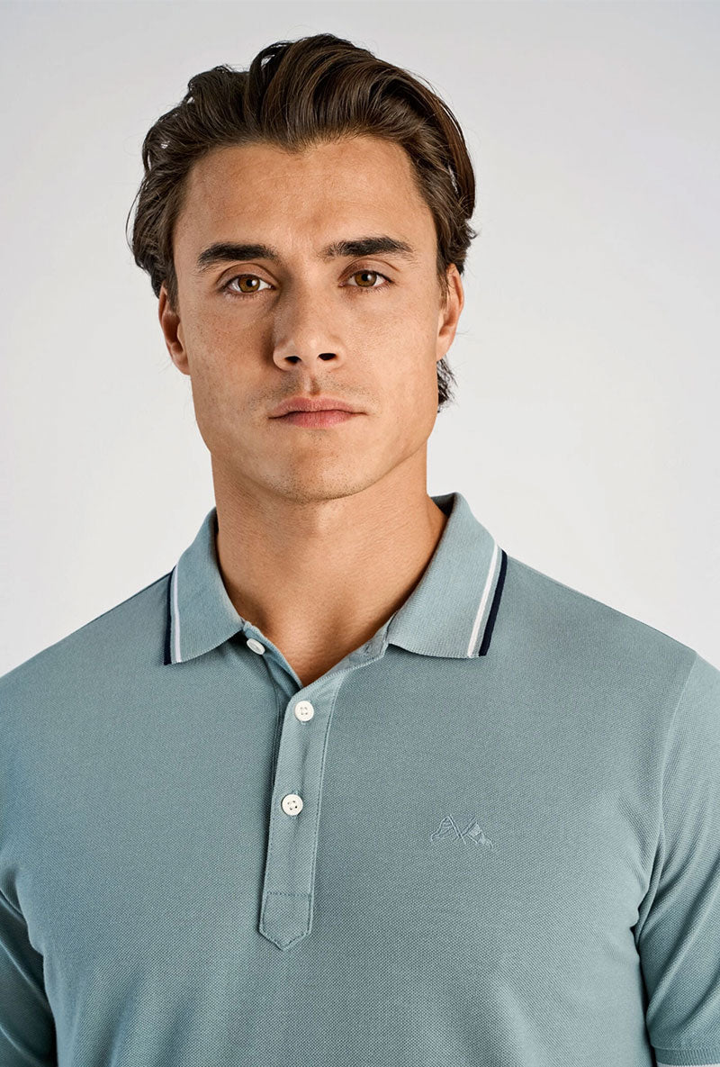 Front image of a model wearing S/s contrast polo in aqua, by brand Lindbergh