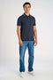 Front image of a model wearing the S/s contrast polo in navy, by brand Lindbergh