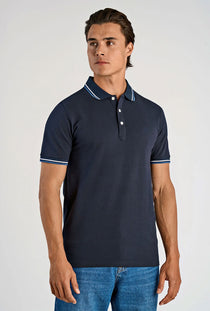 Front image of a model wearing the S/s contrast polo in navy, by brand Lindbergh