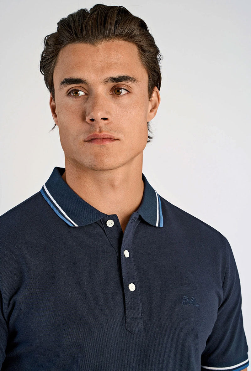 Front image of a model wearing S/s contrast polo in navy, by brand Lindbergh