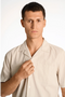 Front image of a model wearing the Seersucker s/s shirt in beige, by brand Lindbergh