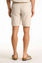 Back image of a model wearing the Seersucker shorts in beige, by brand Lindbergh