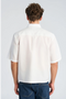 Back image of a model wearing the Solid dobby s/s shirt in white, by brand Lindbergh