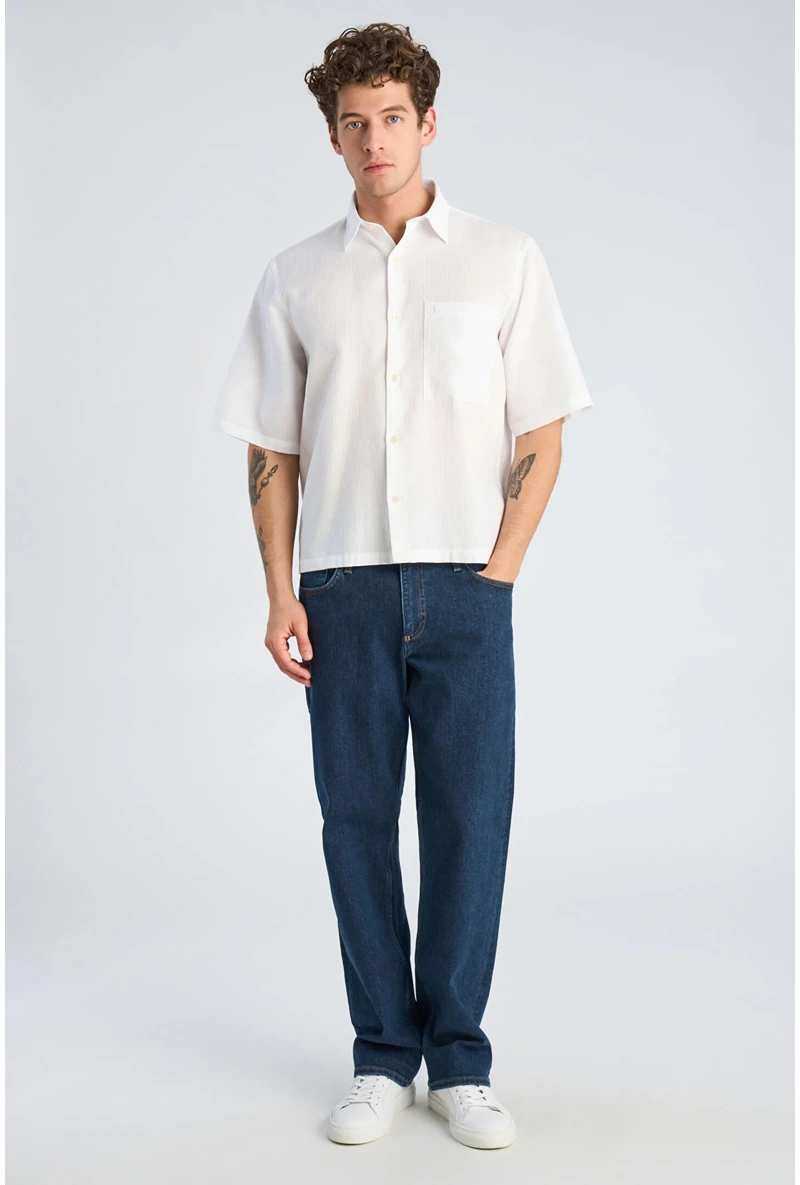 Front image of a model wearing Solid dobby s/s shirt in white, by brand Lindbergh