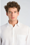 Front image of a model wearing the Solid dobby s/s shirt in white, by brand Lindbergh