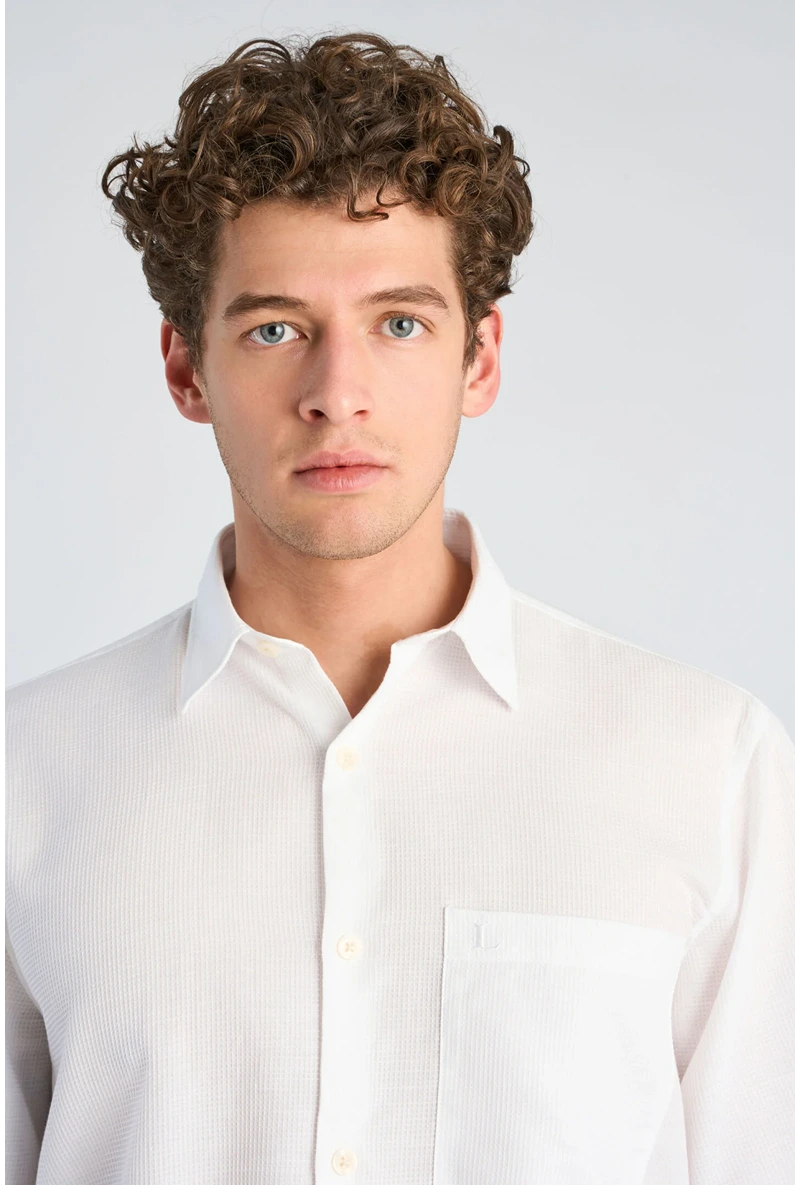Front image of a model wearing Solid dobby s/s shirt in white, by brand Lindbergh