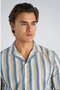 Front image of a model wearing the Striped s/s shirt in blue, by brand Lindbergh