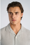 Front image of a model wearing the Striped seersucker shirt in stripe, by brand Lindbergh
