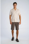 Front image of a model wearing the Striped structure s/s shirt in brown, by brand Lindbergh