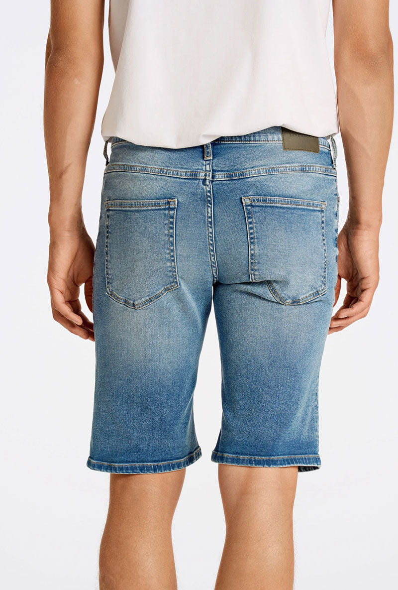 Back image of a model wearing Superflex denim shorts in dark denim, by brand Lindbergh