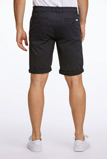 Back image of a model wearing the Superflex relaxed fit chino shorts in black, by brand Lindbergh