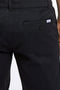 Back detail image of a model wearing the Superflex relaxed fit chino shorts in black, by brand Lindbergh