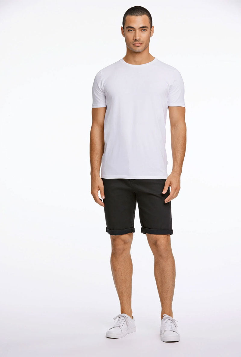 Front image of a model wearing Superflex relaxed fit chino shorts in black, by brand Lindbergh
