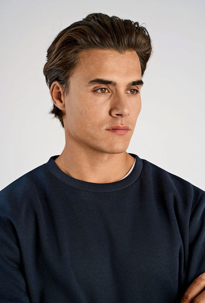 Front image of a model wearing Lindbergh sweatshirt in navy, by brand Lindbergh