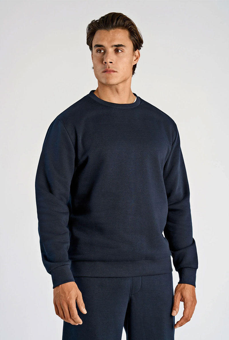Front image of a model wearing Lindbergh sweatshirt in navy, by brand Lindbergh