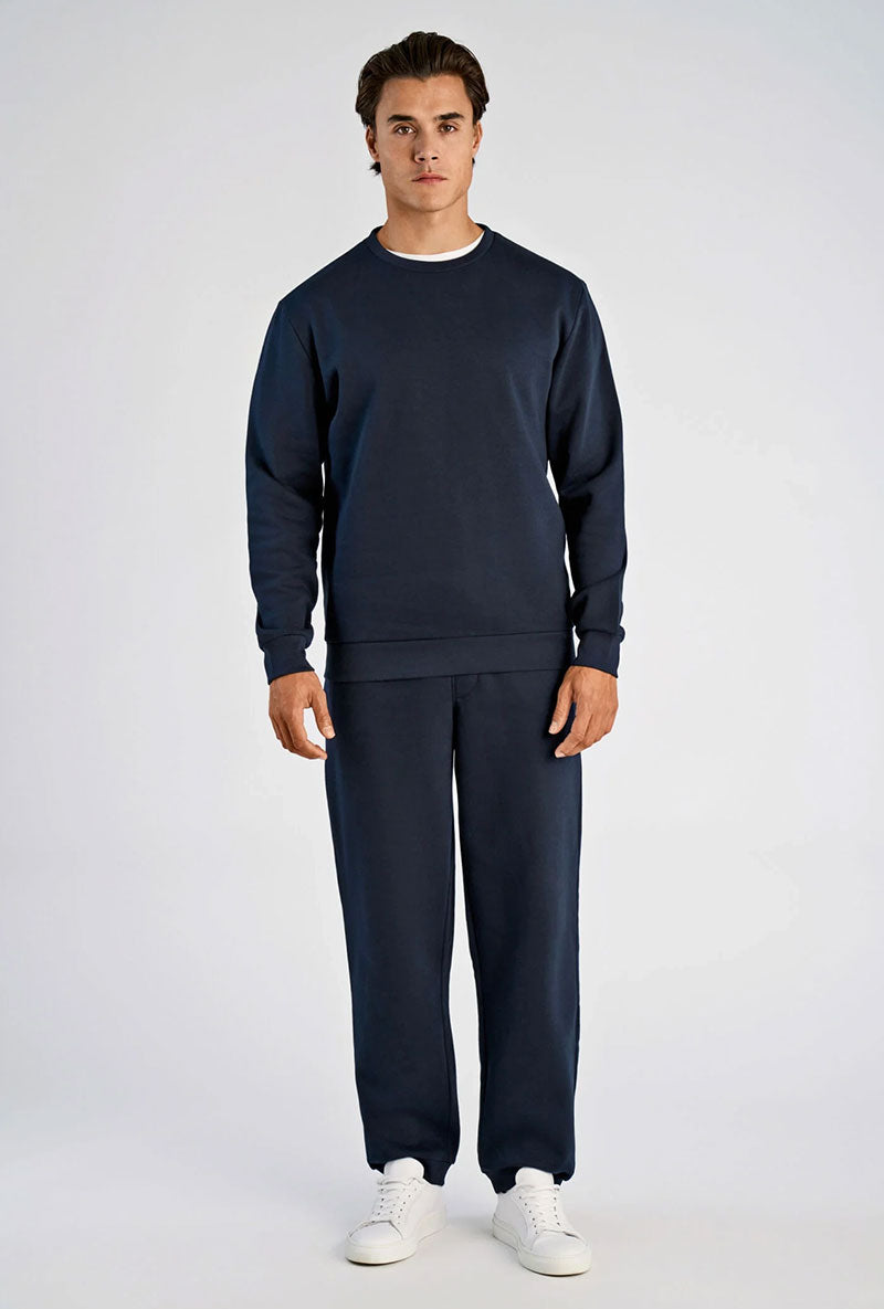 Front image of a model wearing Lindbergh sweatshirt in navy, by brand Lindbergh