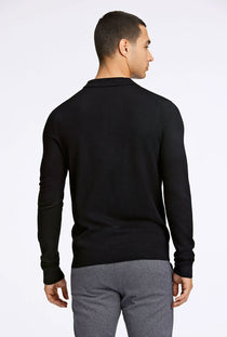 Back image of a model wearing the Ecovero ls polo in black, by brand Lindbergh