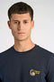 Front image of a model wearing the Embroidery ss tshirt in navy, by brand Lindbergh