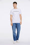 Front image of a model wearing the Lindbergh logo print ss tshirt in white, by brand Lindbergh