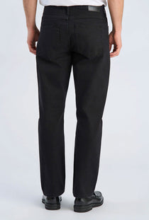 Back image of a model wearing the Loose fit jeans in black, by brand Lindbergh