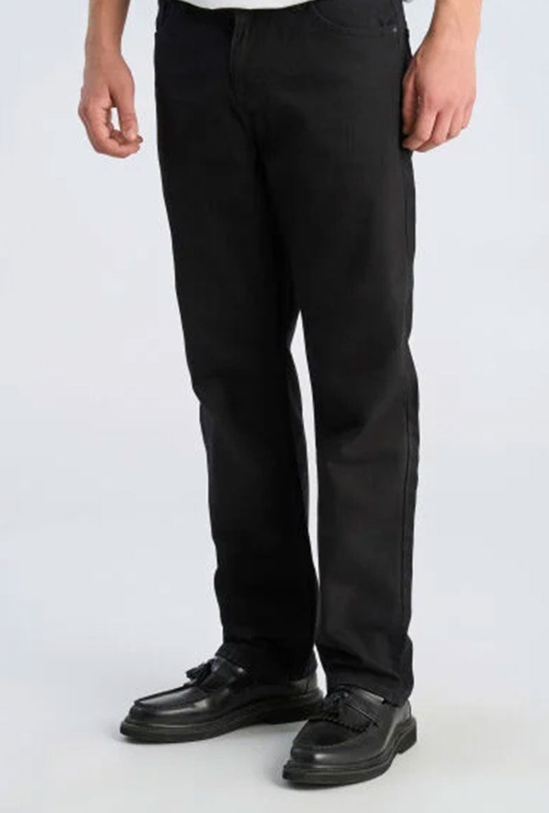 Front image of a model wearing Loose fit jeans in black, by brand Lindbergh