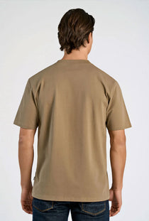 Back image of a model wearing the Oneck oversize tshirt in stone, by brand Lindbergh