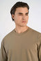 Front image of a model wearing the Oneck oversize tshirt in stone, by brand Lindbergh