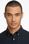 Front image of a model wearing the Oxford superflex ls shirt in black, by brand Lindbergh