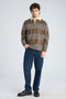 Front image of a model wearing the Rugby polo sweatshirt in brown, by brand Lindbergh