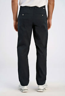Back image of a model wearing the Superflex chino pants in black, by brand Lindbergh