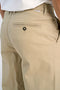 Back image of a model wearing the Superflex chino pants in sand, by brand Lindbergh