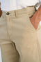 Front image of a model wearing the Superflex chino pants in sand, by brand Lindbergh