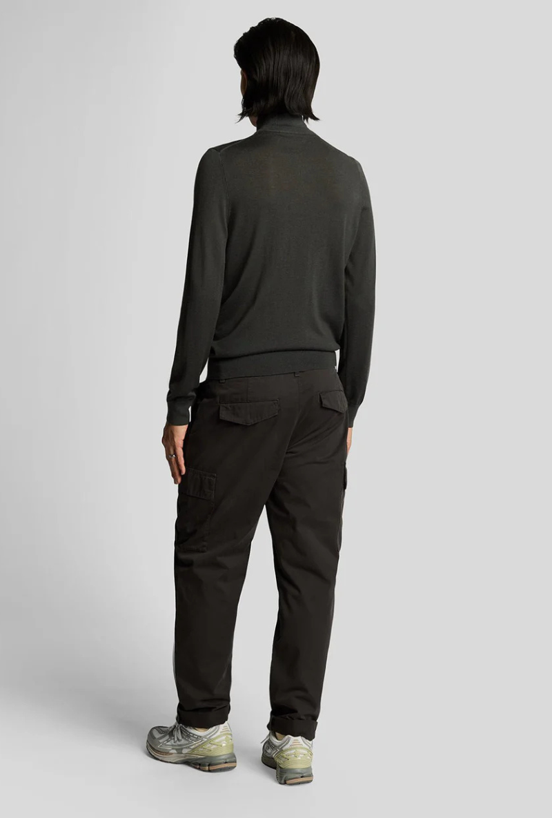 Back image of a model wearing Lyle and scott cargo pocket trousers in black, by brand Lyle and scott