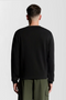 Back image of a model wearing the Lyle and scott cheers to tradition sweatshirt in black, by brand Lyle and scott