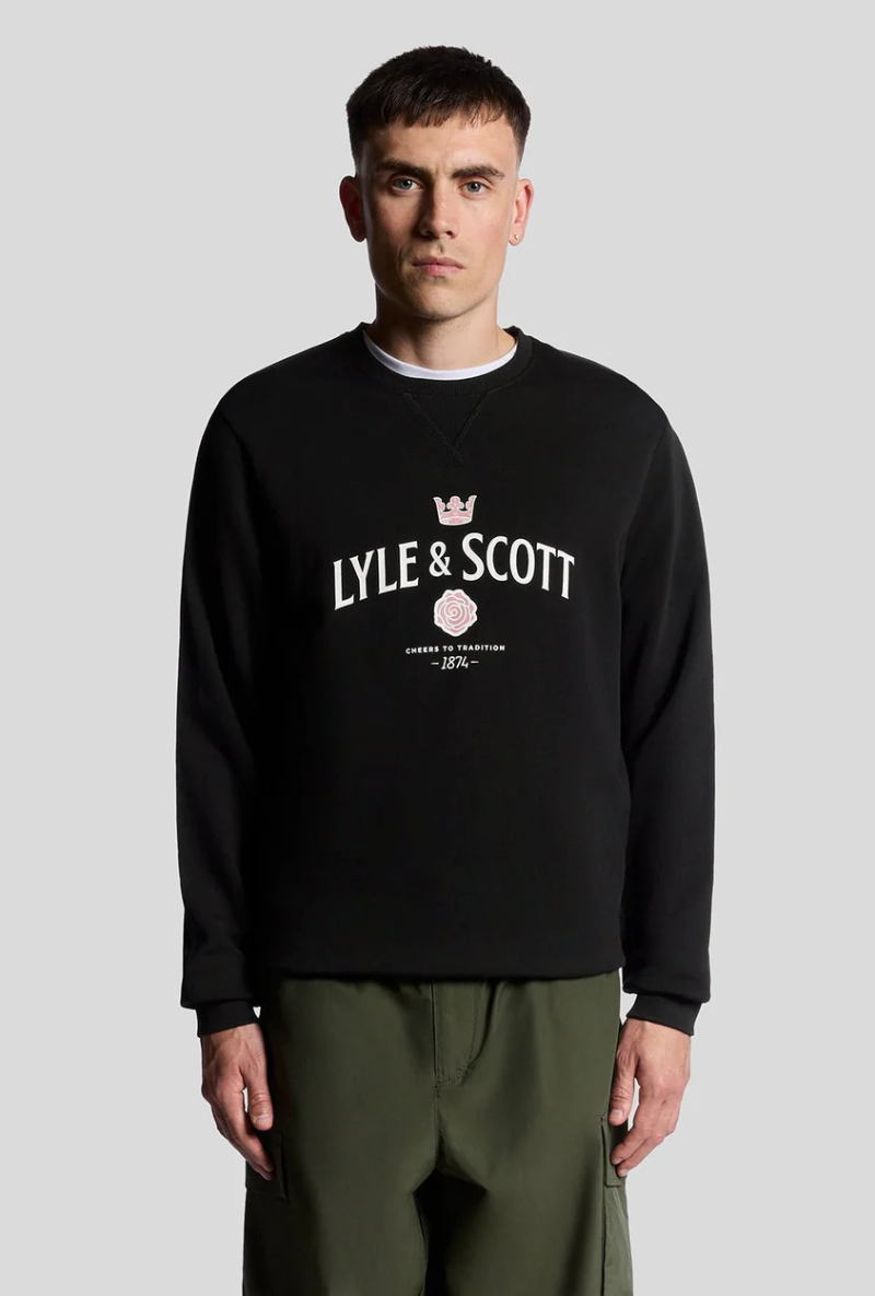 Front image of a model wearing Lyle and scott cheers to tradition sweatshirt in black, by brand Lyle and scott