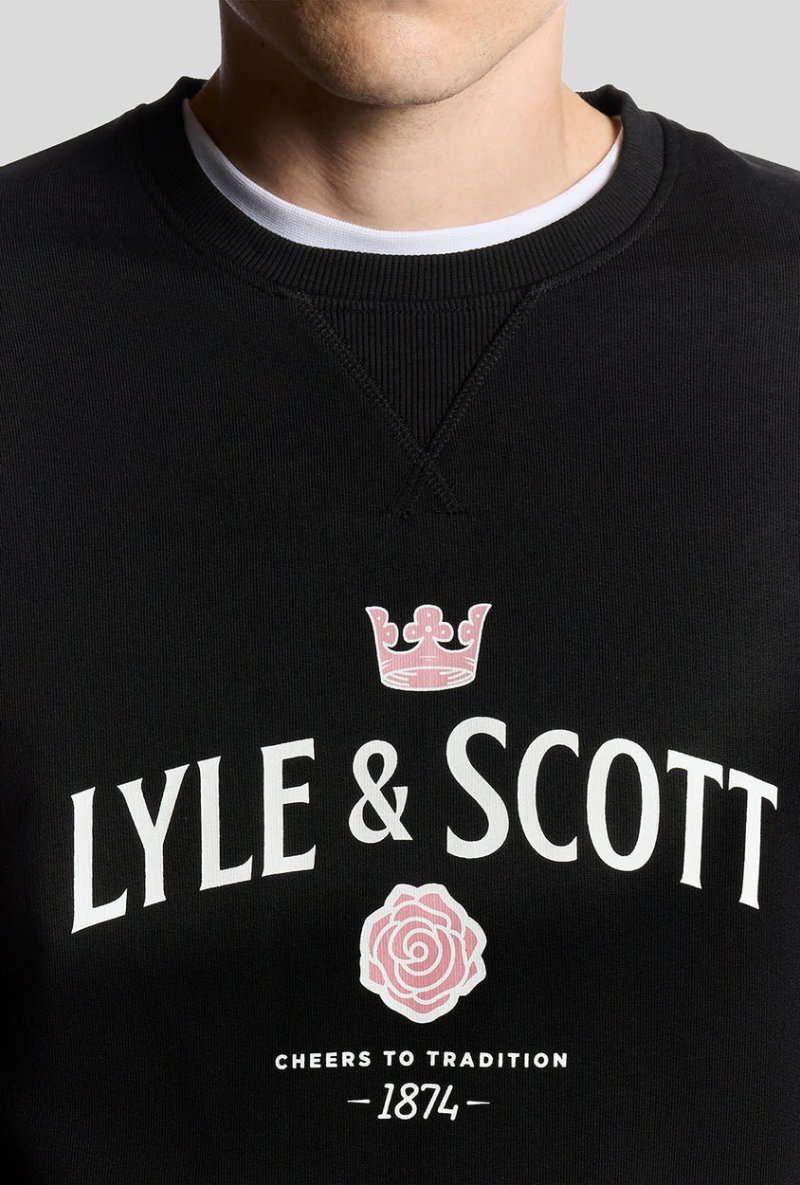 Front detail image of a model wearing Lyle and scott cheers to tradition sweatshirt in black, by brand Lyle and scott