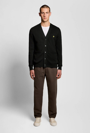Front image of a model wearing Lyle and scott merino v neck cardigan in black, by brand Lyle and scott