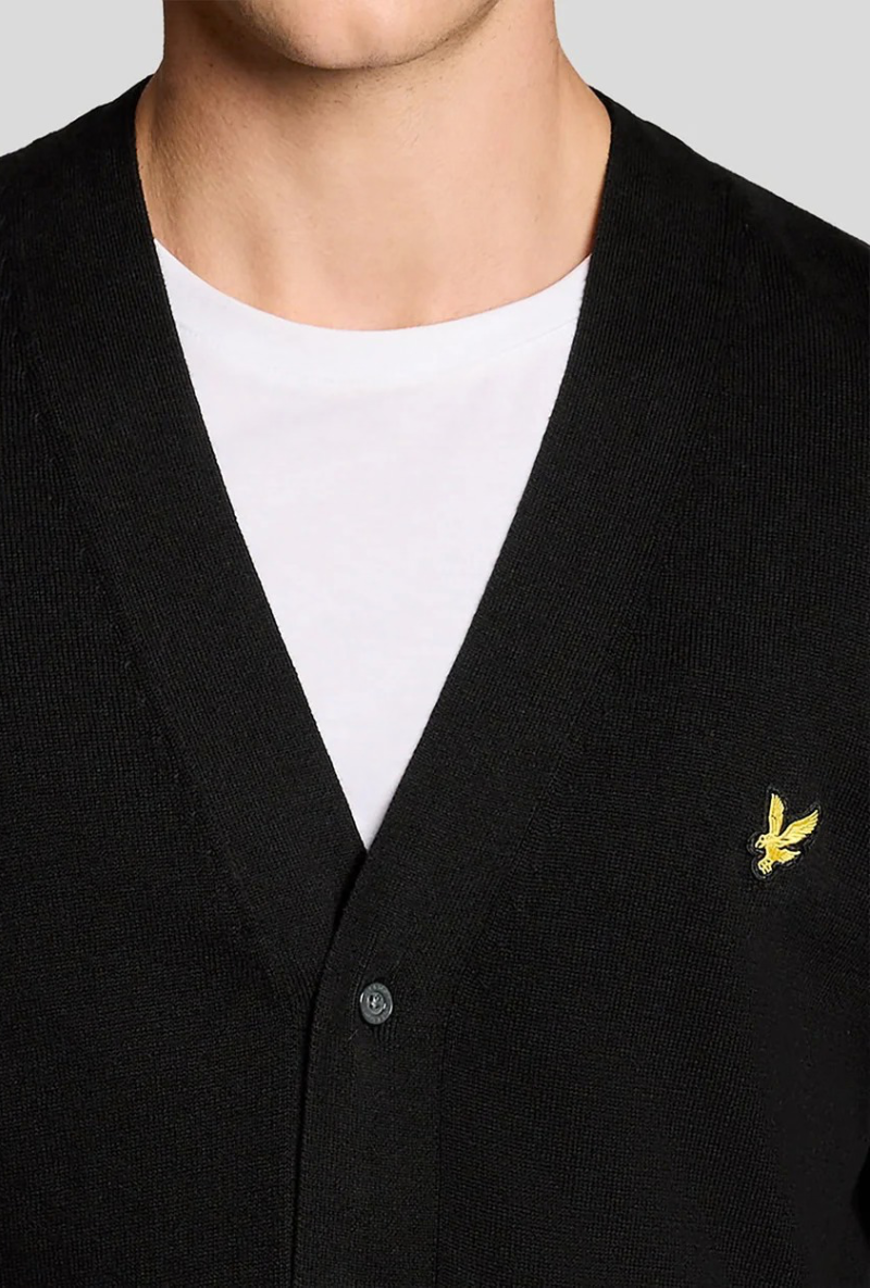 Front detail image of a model wearing Lyle and scott merino v neck cardigan in black, by brand Lyle and scott